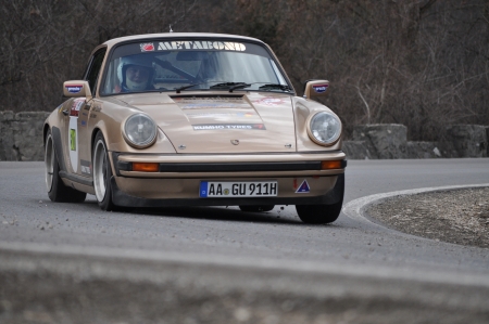 BRASOV, ROMANIA - APRIL 9 2011: Gunther Graef/Cibu Cristian Sever in a Porsche 911 SC at TESS Rally Brasov 2011のeditorial素材