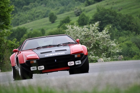 TELIU, ROMANIA - MAY 19 2012: Popescu Horia with a beautiful DeTomaso Pantera at Trophy Teliu 2012 hillclimbのeditorial素材