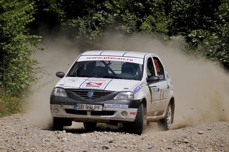 SIBIU, ROMANIA - JULY 15 2010:  Nastase Bogdan/Popidan Alexandru - Dacia Logan - Sibiu Rally 2010のeditorial素材