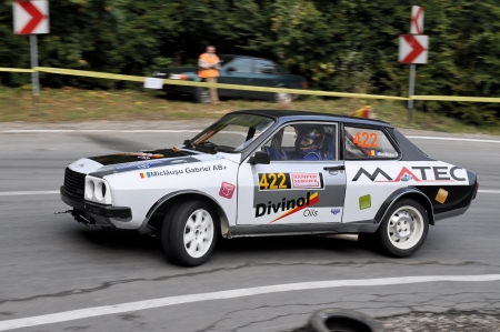 RASNOV, ROMANIA - SEPTEMBER 30 2010: Miclausu Gabriel Ioan - Dacia Sport - Trophy Rasnov 2010のeditorial素材