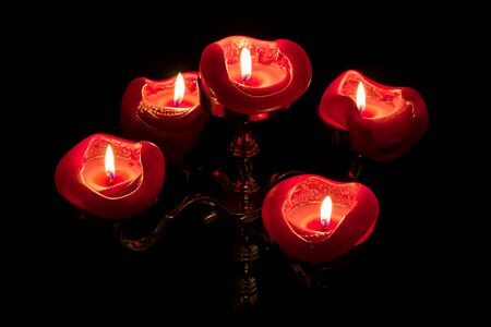 Five candles on top of a candelabra.の写真素材