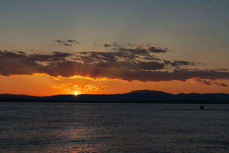 Sunset over the mountains of the Croatian coast. A summer scene.の写真素材
