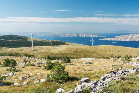 Wind turbines in the grasslands of the Croatian mountains.の写真素材