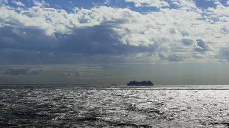 Silhouette of a cruise ship sailing along the horizon of the Caribean.の写真素材