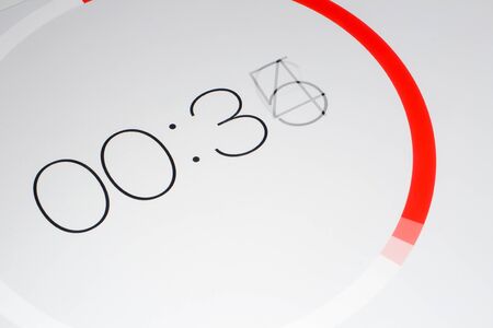A digital timer, counting down, in closeup.の写真素材