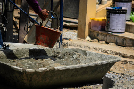 Mixing concrete with sandの写真素材