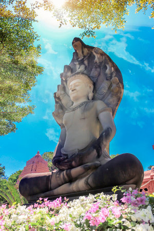 Old Buddha behind sky background.の写真素材