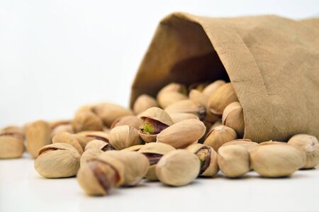Paper bag with pistachiosの写真素材