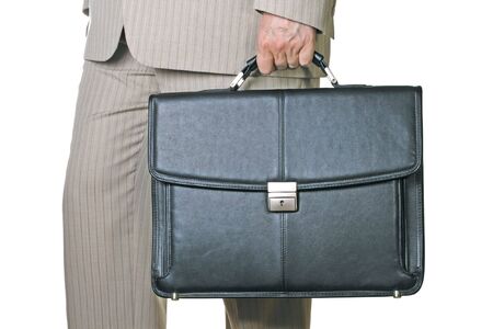 Business briefcase holding in hand man in suitの写真素材