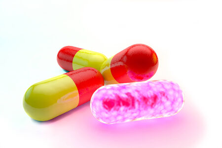 Group of glowing pills. Medical breakthrough, cure, isolated on white backgroundの写真素材