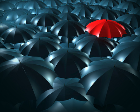Standing out from the crowd concept with umbrellasの写真素材