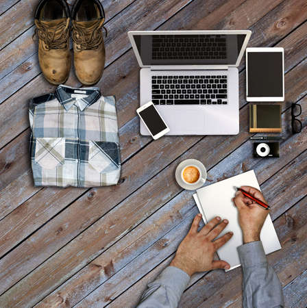 Vintage hipster wooden desktop top view and male hands. Responsive design mockup. Hero header imageの写真素材