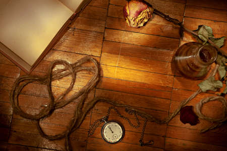 Set of the old trifles scattered on a wooden backgroundの写真素材