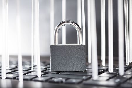 lock on a computer keyboard with a luminous vertical bars