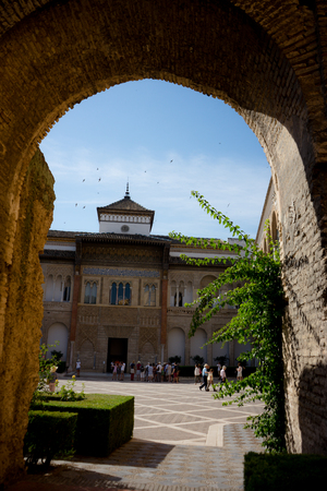 Seville, Spain - June 19: The real Alcazar, Seville, Spain on June 19, 2017. Tourists walking in the courtyard on a warm summer day.のeditorial素材