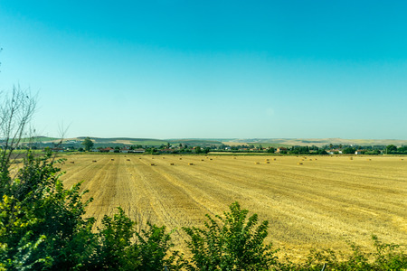 Bale of Hay on a field on the outskirts of Cordoba, Spain, Europe on a hot summer day with clear blue skiesの写真素材