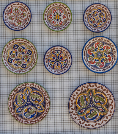 China decorations on a plate on a wall in the city of Ronda Spain, Europe on a hot summer day with...