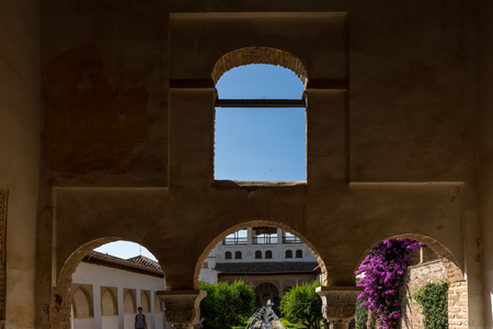View of The Generalife courtyard, with its famous fountain and garden through an arch. Alhambra de Granada complex at Granada, Spain, Europe on a bright summer dayのeditorial素材