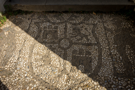 Shield patterns on a stone walking path at the Alhambra palace in Granada, Spain, Europe on a bright summer dayのeditorial素材