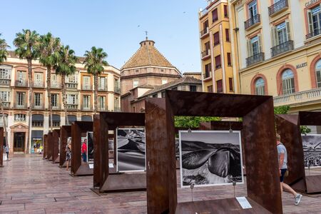 Malaga, Spain - June 24: Tourists walk past the paintings at Caixa Forum in Malaga, Spain, Europe on a bright sunny morningのeditorial素材