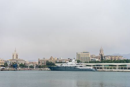 Malaga, Spain - June 24: A blue cruiser called  docked in the port at Malaga, Spain, Europe on a bright sunny morningのeditorial素材