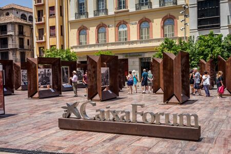 Malaga, Spain - June 24: Tourists walk past the paintings at Caixa Forum in Malaga, Spain, Europe on a bright sunny morningのeditorial素材