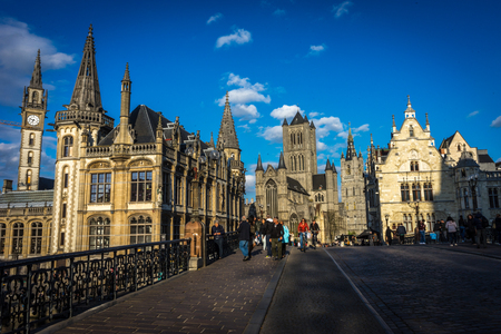 Ghent Belgium - April 15 : Toursists walk in front of the St.nikolas' church at sunset in Ghent, Belgium, Europeのeditorial素材