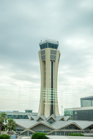 Malaga, Spain - June 25, 2017 :  The beautiful control tower at the scenic Malaga airport with a hill behind, Malaga, Spain, Europeのeditorial素材
