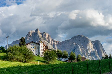 Kastelruth, Italy - 29 June 2018: The parc hotel Tyrol in town of Kastelruth, Castelrotto in Italy with dolomite backgroundのeditorial素材