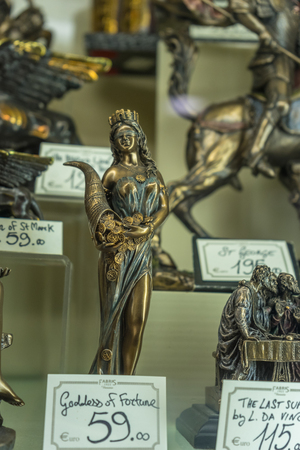 Venice, Italy - 30 June 2018: Fortune Goddess artifacts on display in a shop in Venice, Italyのeditorial素材