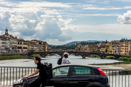 Florence, Italy - 25 June 2018:Traffic on a bridge over the Arno river at Florence, Italyのeditorial素材