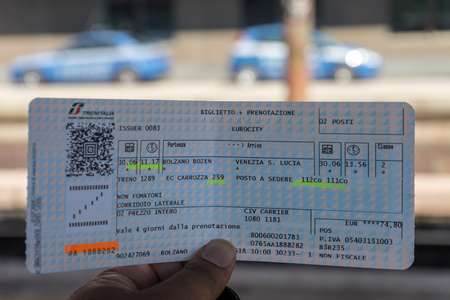 Bolzano, Italy - 30 June 2018: Hand holding a train ticket in Bolzano, Italyのeditorial素材