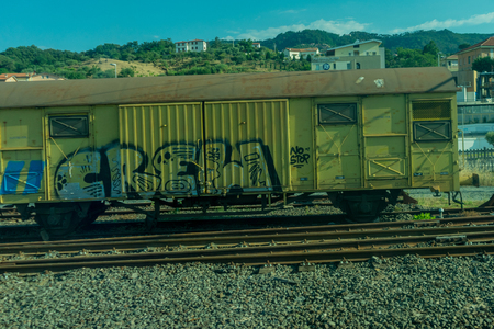 Italy - 28 June 2018: The graffiti on Trenitalia in the italian outskirts trackのeditorial素材