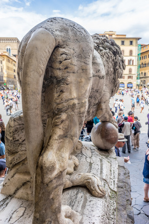 Florence, Italy - 25 June 2018:  Piazza della Signoria with the Medici Lion at Loggia dei Lanzi in Florence, Italyのeditorial素材