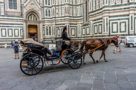 Florence, Italy - 25 June 2018: horse drawn cart in Piazza San Giovanni in Florence, Italyのeditorial素材
