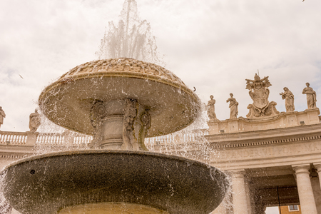 Vatican City, Italy - 23 June 2018: the Obelisk and Colonnades at St. Peter's Square with water fountain in Vatican Cityのeditorial素材