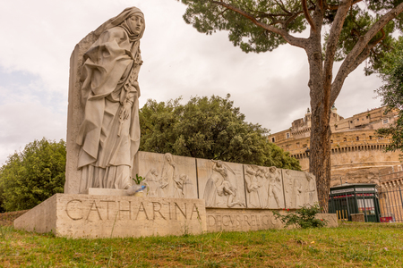 Rome, Italy - 23 June 2018: Statue of San Catharina Da Siena near the castle, Rome, Italyのeditorial素材