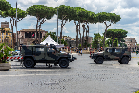 Rome, Italy - 23 june 2018: Armoured trucks standing guard at Monument to Vittorio Emanuele II viewed from tomb of the unknown soldier in Rome,Italyのeditorial素材