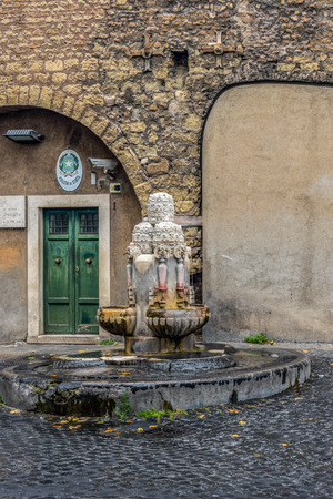 Vatican City, Italy - 23 June 2018: Water fountain in front of a police stationのeditorial素材