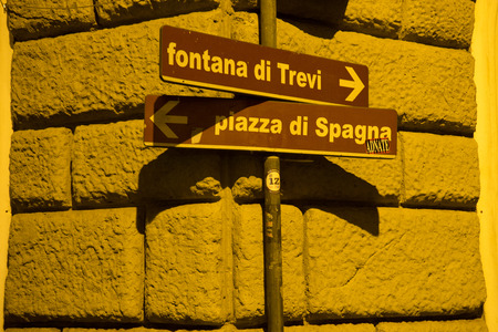 Rome, Italy - 24 June 2018: Traffic sign board pointing to Trevi fountain (fontana di trevi) and piazza di spagna in Rome, Italyのeditorial素材