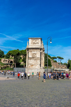 Rome, Italy - 24 June 2018: The ancient ruins of the arch of Constantine at Rome viewed from the colosseum. Famous world landmark. Scenic urban landscape.のeditorial素材
