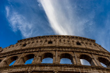 Golden sunset at the Great Roman Colosseum (Coliseum, Colosseo), also known as the Flavian Amphitheatre. Famous world landmark. Scenic urban landscape.の写真素材