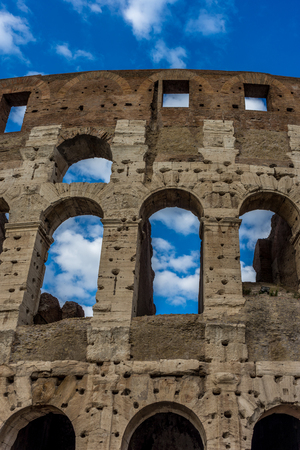 Facade of the Great Roman Colosseum (Coliseum, Colosseo), also known as the Flavian Amphitheatre. Famous world landmark. Scenic urban landscape.の写真素材