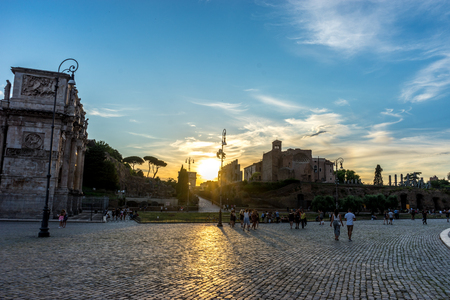 Rome, Italy - 24 June 2018: Golden sunset at the ancient ruins at the Roman Forum of Temple of Venus and Roma at Rome viewed from the colosseum. Famous world landmark. Scenic urban landscape.のeditorial素材