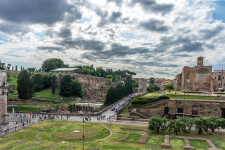 Rome, Italy - 23 June 2018: The ancient ruins at the Roman Forum of Temple of Venus and Roma at Rome viewed from the colosseum. Famous world landmark. Scenic urban landscape.のeditorial素材