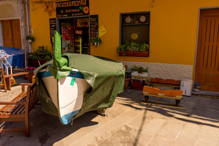 Manarola, Cinque Terre, Italy - 27 June 2018: Boat covered by tarpaulin on streets of Manarola, Cinque Terre, Italyのeditorial素材