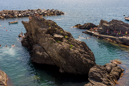 Manarola, Cinque Terre, Italy - 27 June 2018: Tourists enjoying the beach and sunshine at Manarola, Cinque Terre, Italyのeditorial素材