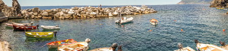 Manarola, Cinque Terre, Italy - 26 June 2018: Boats docked at the cove of Manarola, Cinque Terre,...
