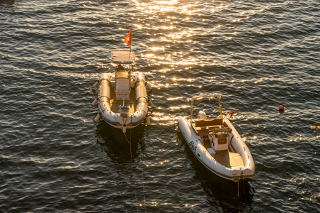 Riomaggiore, Cinque Terre, Italy - 26 June 2018: Boats and yachts on the ocean during sunset, Italian Riviera of Riomaggiore, Cinque Terre, Italyのeditorial素材