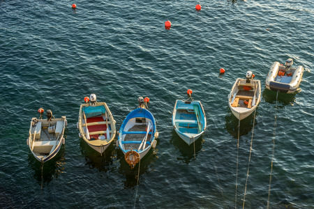 Boats and yachts on the ocean during sunset, Italian Riviera of Riomaggiore, Cinque Terre, Italyのeditorial素材